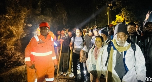 Police rescuing people trapped in a landslide.