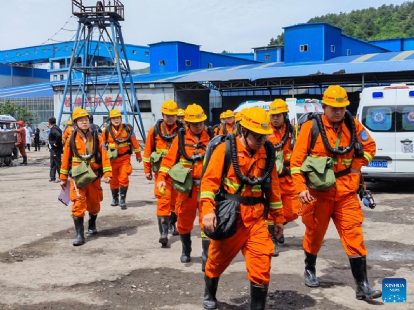 Rescue and relief personnel engaged in operations at the incident site.