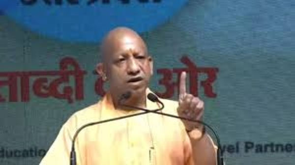 Yogi addressing a Hindi daily newspaper event here on Monday