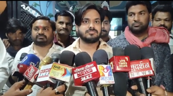 Anurag Prajapati, son of Maharaji Prajapati speaking to reporters Anurag Prajapati, son of Maharaji Prajapati speaking to reporters