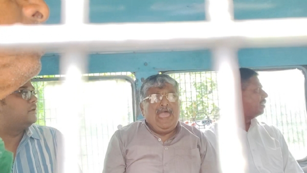 Asit Majumdar in prison van