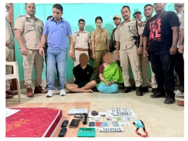 Image of the Two Held Accused, Including Woman, with Arms and Ammunition in Silchar