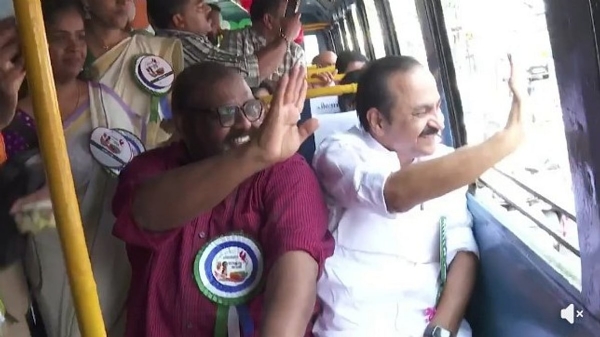 Kerala CM VD Satheeshan and transport minister CP John waving to public