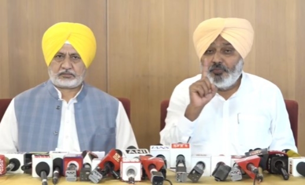 Punjab Finance Minister Harpal Cheema and AAP General Secretary and Media Incharge Baltej Pannu addressing press conference.