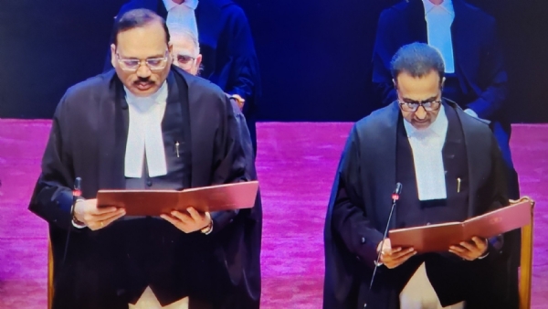 Chief Justice Surya Kant administering the oath of office to the newly appointed judge.