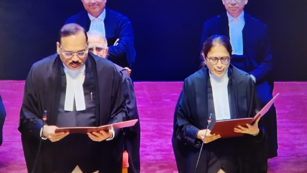 Chief Justice Surya Kant administering the oath of office to the newly appointed judge.