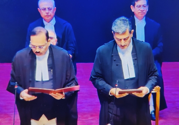 Chief Justice Surya Kant administering the oath of office to the newly appointed judge.