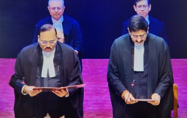 Chief Justice Surya Kant administering the oath of office to the newly appointed judge.