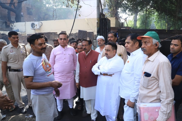 Delhi BJP President Harsh Malhotra meets families and shopkeepers affected by the devastating fire in Valmiki Basti.