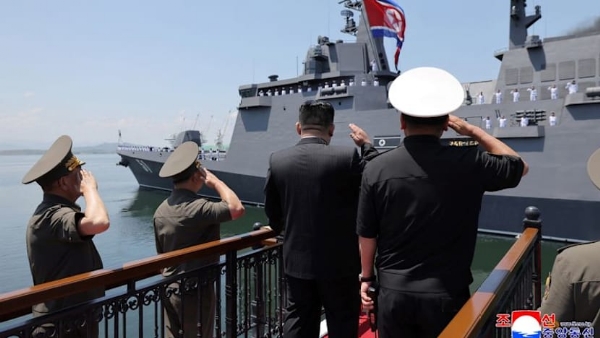 North Korean leader Kim Jong Un salutes during the commissioning ceremony of the new multipurpose destroyer Choe Hyon at Nampho port, North Korea