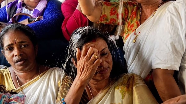 Bindu Krishna with the payasam spilled on her head