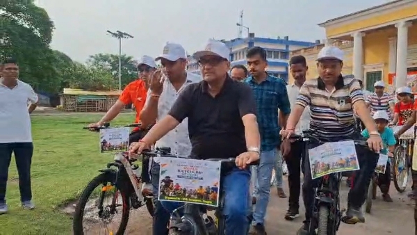 Minister riding a bicycle