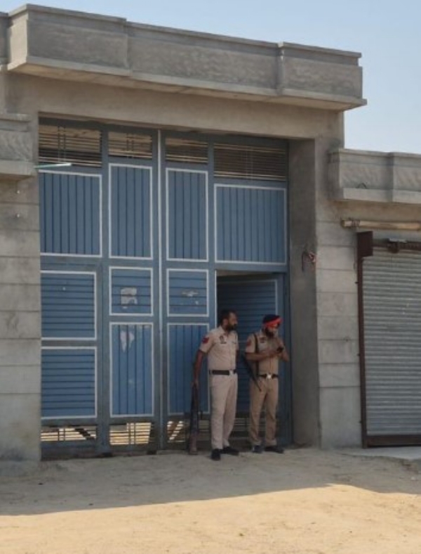 Punjab police outside the house of Yadwinder Singh alias Preet. Punjab police outside the house of Yadwinder Singh alias Preet.