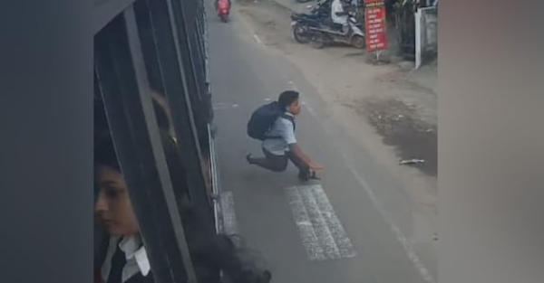 School boy thrown out of moving bus