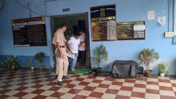 The TMC leader being taken out of the Police station