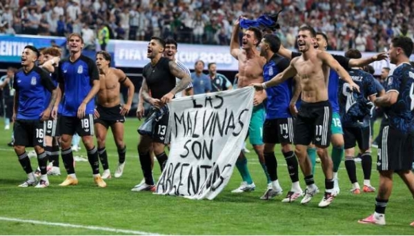 Argentina players hold up a banner expressing support for the Falkland Islands (Islas Malvinas). Argentina players hold up a banner expressing support for the Falkland Islands (Islas Malvinas).