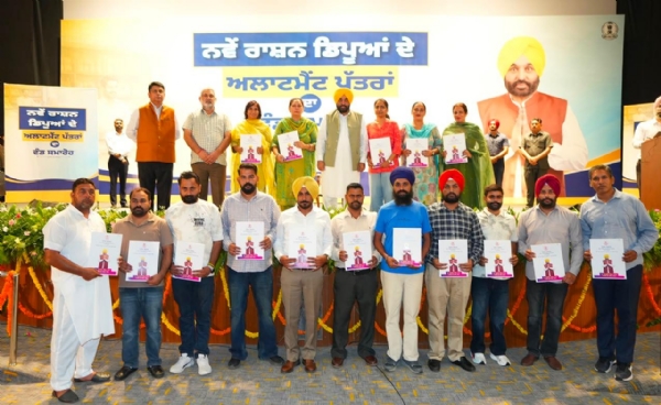 CM Bhagwant Singh Mann hand over licences to newly selected ration depot holders.