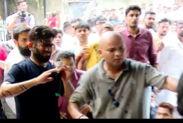 A woman throws ink at CJP chief Abhijeet Dipke during a protest over Sonam Wangchuk’s hospitalisation at Jantar Mantar in New Delhi. A woman throws ink at CJP chief Abhijeet Dipke during a protest over Sonam Wangchuk’s hospitalisation at Jantar Mantar in New Delhi.