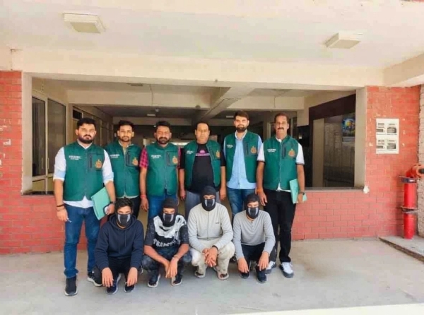 Police personnel escort the four arrested terror suspects following their arrest