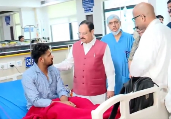 Union Minister Nadda meeting the injured youth. Union Minister Nadda meeting the injured youth.