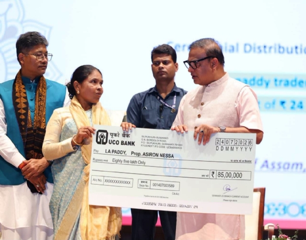 Assam CM Dr Himanta Biswa Sarma Handing over the Sanctioned Loan Cheques to Women . Assam CM Dr Himanta Biswa Sarma Handing over the Sanctioned Loan Cheques to Women .