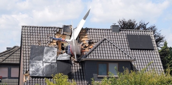 A private plane crashed onto the roof of a house in Germany, killing two people.