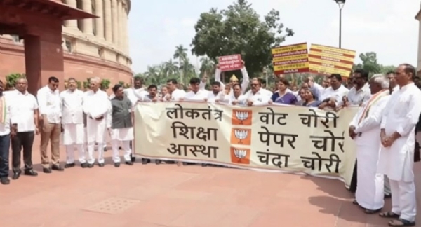 Opposition MPs, including Priyanka Gandhi, stage a protest at Makar Dwar of Parliament.