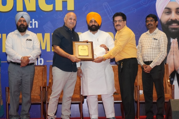 Minister Harjot Singh Bains and AAP Punjab in-charge Manish Sisodia felicitating principal
