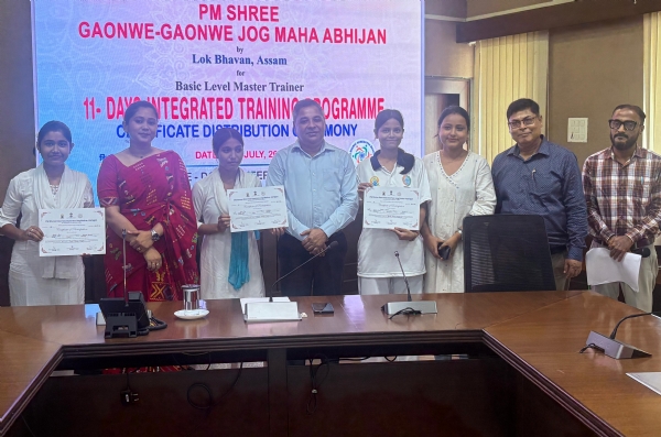 Kamrup District Commissioner Deba Kumar Mishra distributing appreciation certificates.
