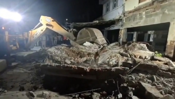 The collapsed four-storey building in Sector 16, Rohini, Delhi, on Wednesday evening. The collapsed four-storey building in Sector 16, Rohini, Delhi, on Wednesday evening.
