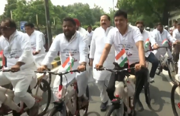 Delhi Aam Aadmi Party president Saurabh Bharadwaj, along with party MLAs, stages a protest while riding bicycles.