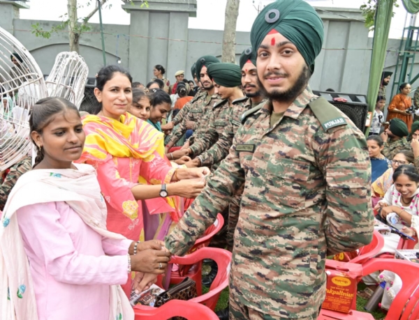 Girls Tying Rakhi to Army Personnel