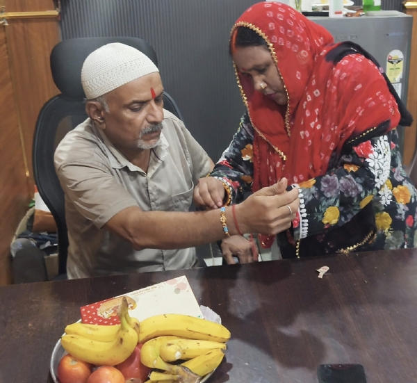 Hindu woman tying rakhi to Muslim brother on Rakshabandhan Hindu woman tying rakhi to Muslim brother on Rakshabandhan