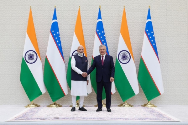 PM Narendra Modi with Uzbek President Shavkat Mirziyoyev PM Narendra Modi with Uzbek President Shavkat Mirziyoyev