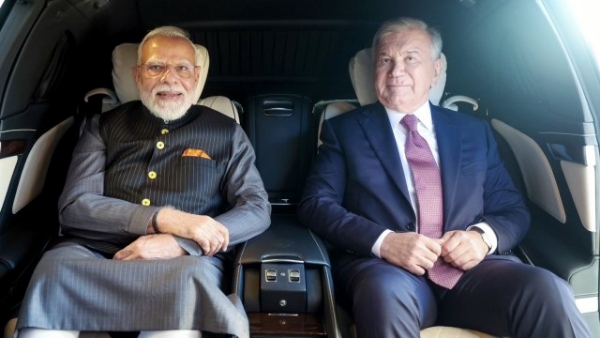 Prime Minister Narendra Modi shares a car ride with Uzbekistan President Shavkat Mirziyoyev in Tashkent,