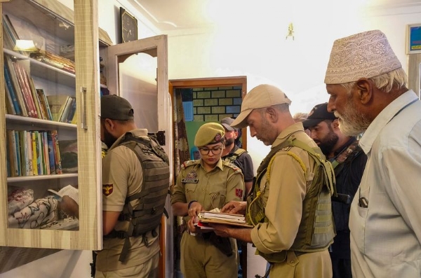 Security officials conduct a search operation in connection with a UAPA case registered against banned organisation Jamaat-e-Islami (JeI), in Sopore, Jammu and Kashmir. Security officials conduct a search operation in connection with a UAPA case registered against banned organisation Jamaat-e-Islami (JeI), in Sopore, Jammu and Kashmir.