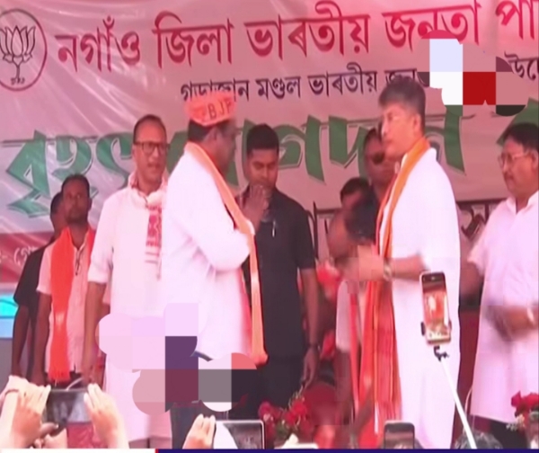 Minister Pijush Hazarika and MLA Pradyut Bordoloi in a joining program of the BJP at Rupahi in Samaguri on Sunday.