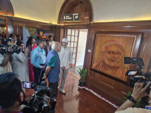 Nripendra Misra viewing the exhibition.