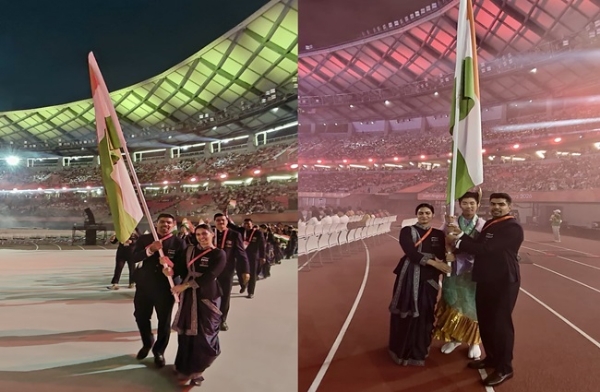 Manu Bhaker and Pawan Sehrawat holding the Indian flag. Photo: Indian Olympic Association’s social media account on X.