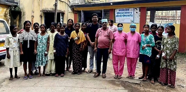 The schoolgirls with hospital staff
