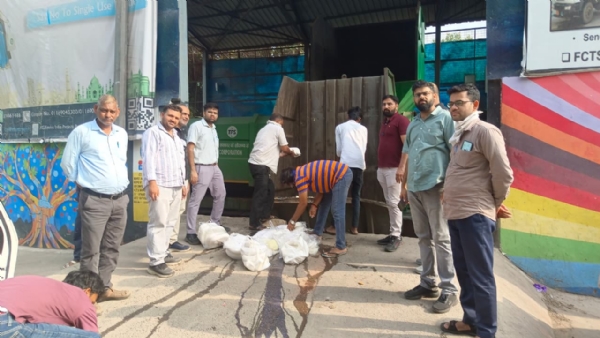 Food Safety Department officials destroying suspected adulterated paneer during an enforcement drive.