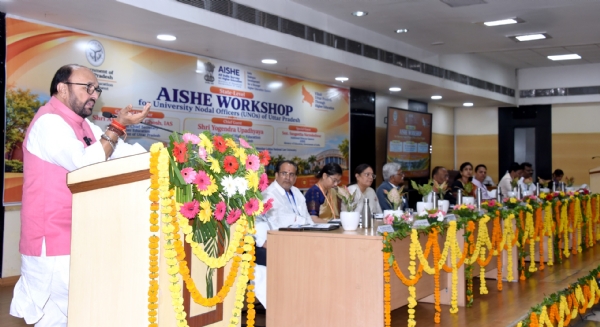 Higher Education Minister addressing university nodal officers at state-level AISHE