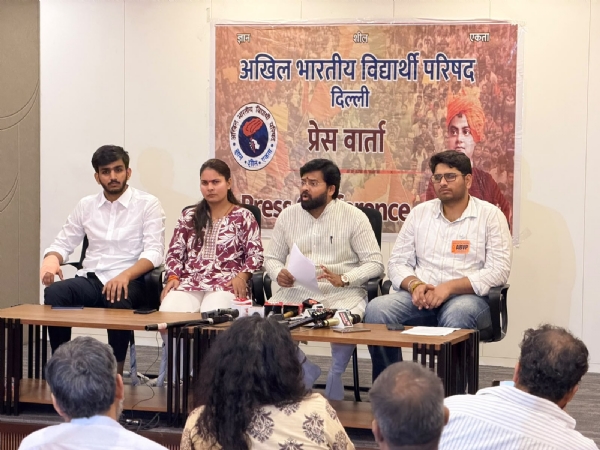 DUSU President Aryan Maan and Delhi State Secretary Sarthak Sharma during a press conference with ABVP National General Secretary Dr. Virendra Singh Solanki.