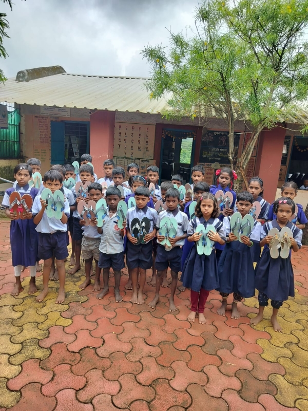 School children with recu=ycled footwear and school bags