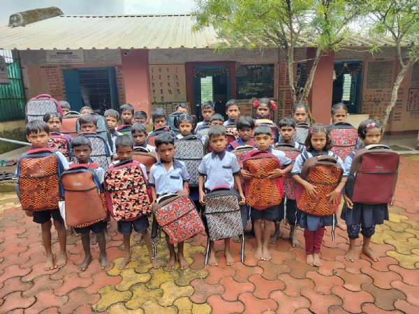 Children with recycled Footwear and schoolbags
